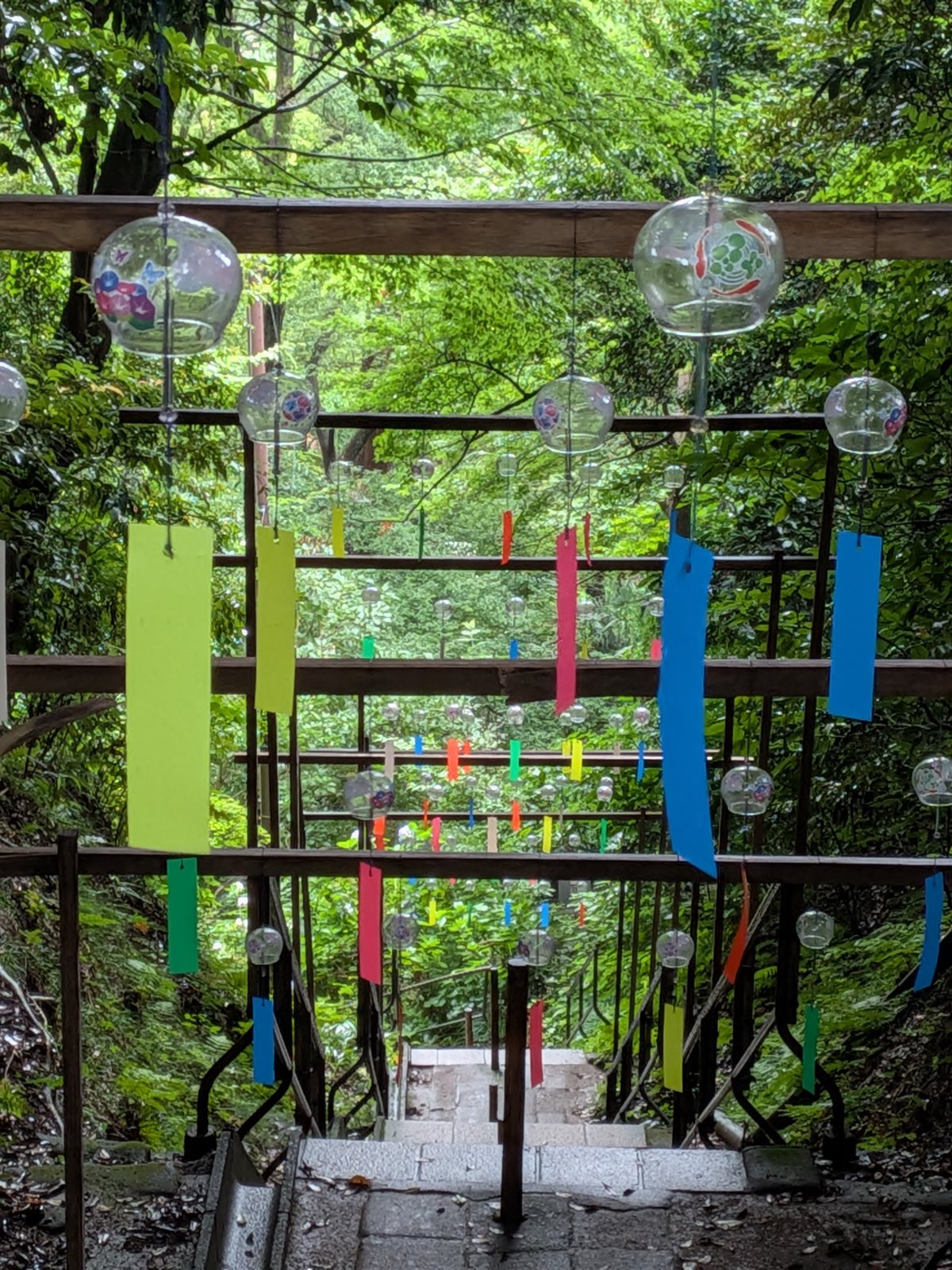 Summer wind chimes above temple steps