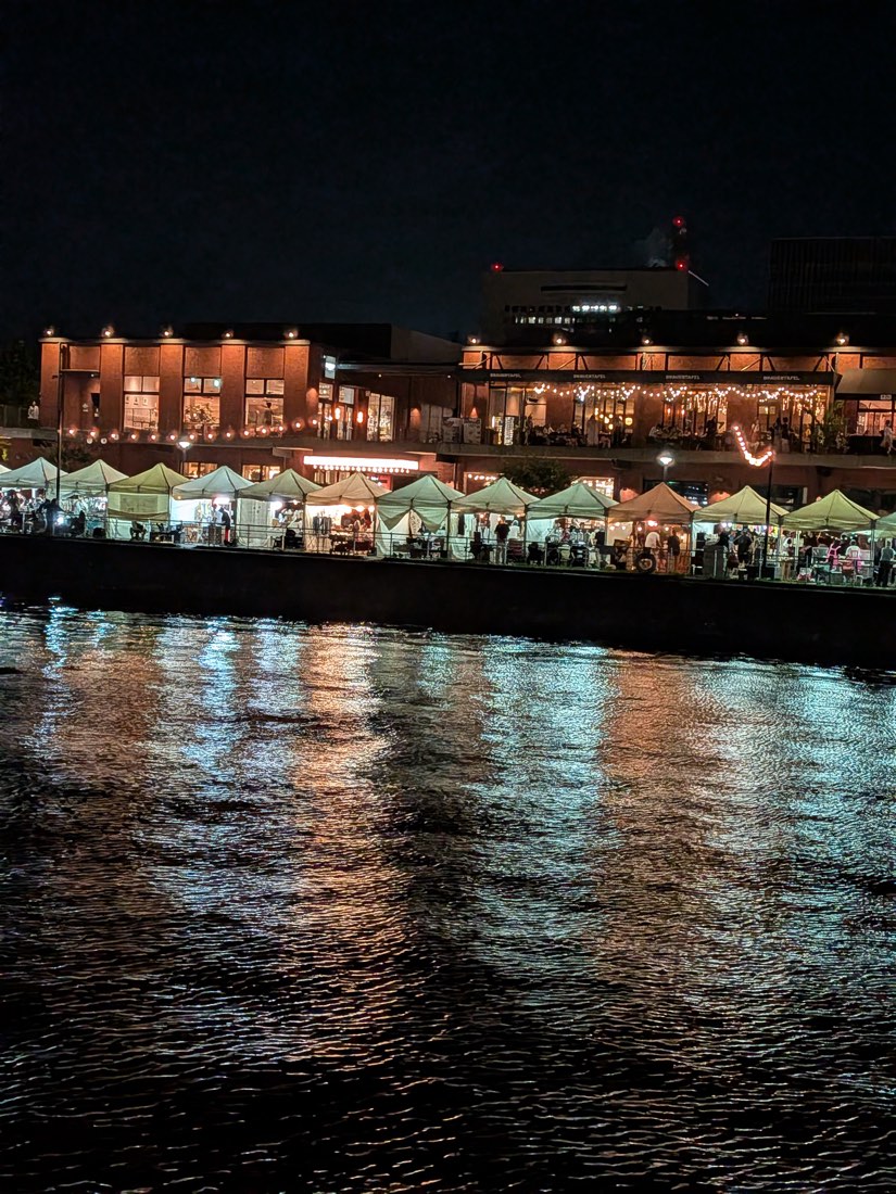 The red brick warehouses lit up at night